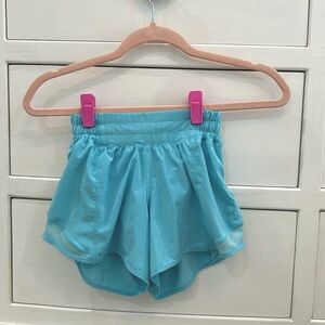 Electric turquoise Lululemon shorts size 0.